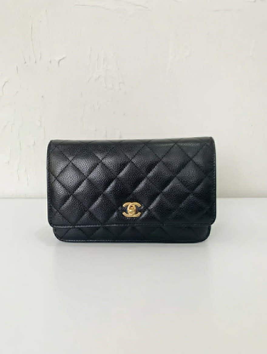 Chanel Classic Wallet on Chain (WOC) in Black Caviar Leather.